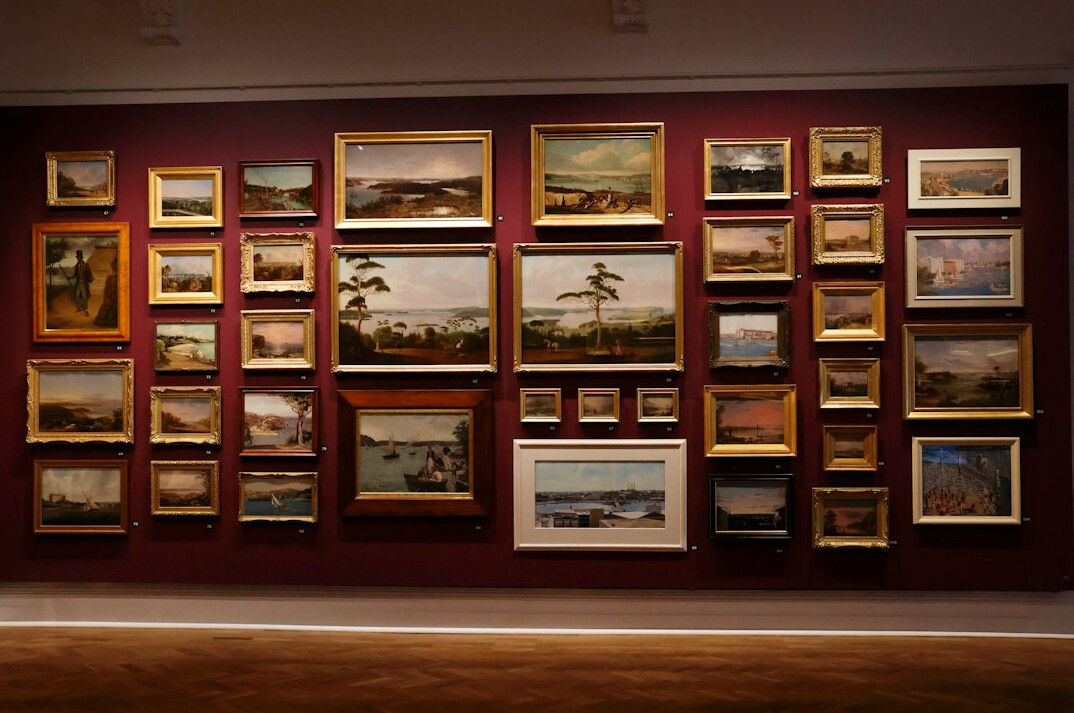 Framed documentary photographs displayed on a gallery wall
